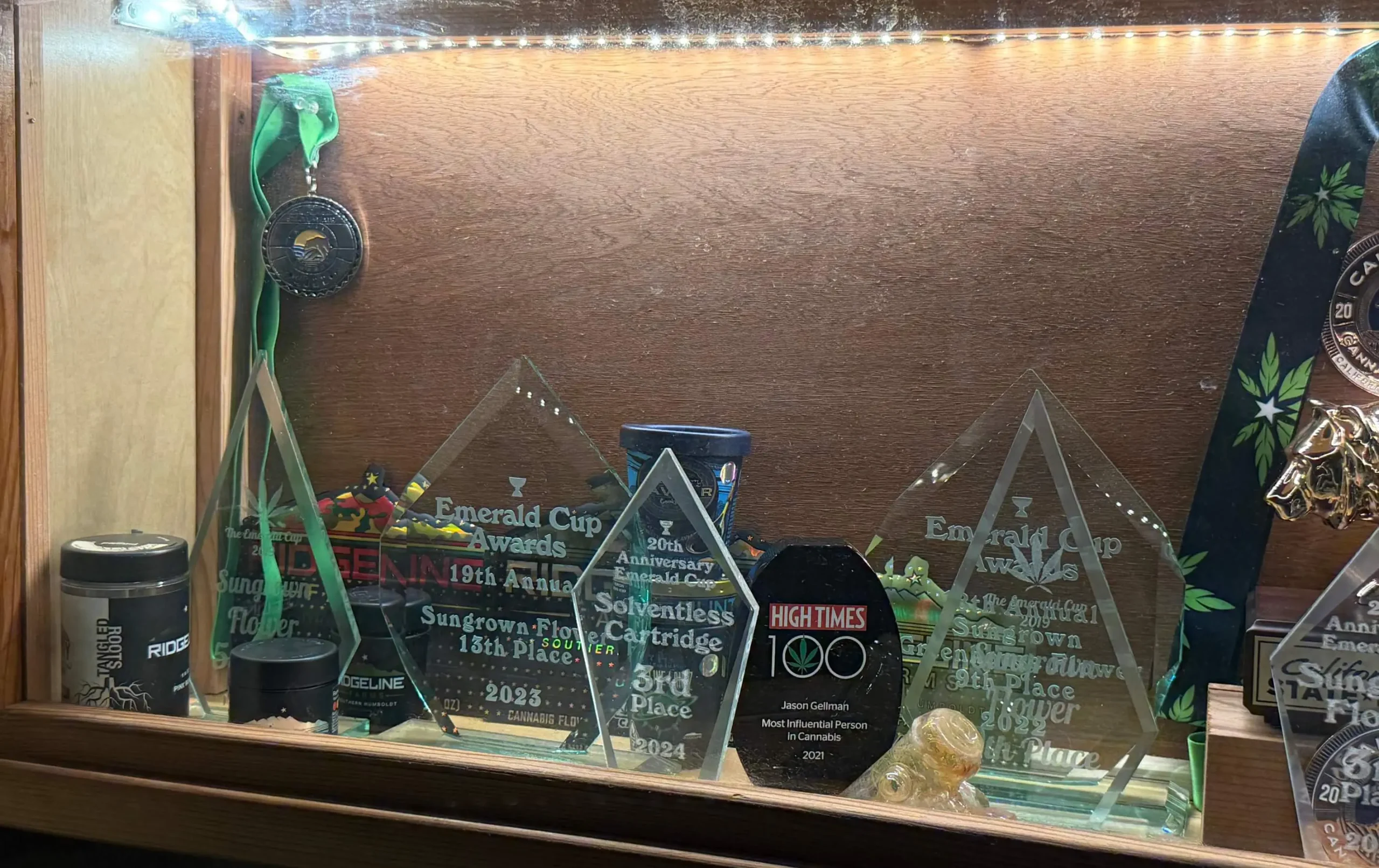 Ridgeline Farms cannabis cultivation awards and trophies displayed in a glass showcase
