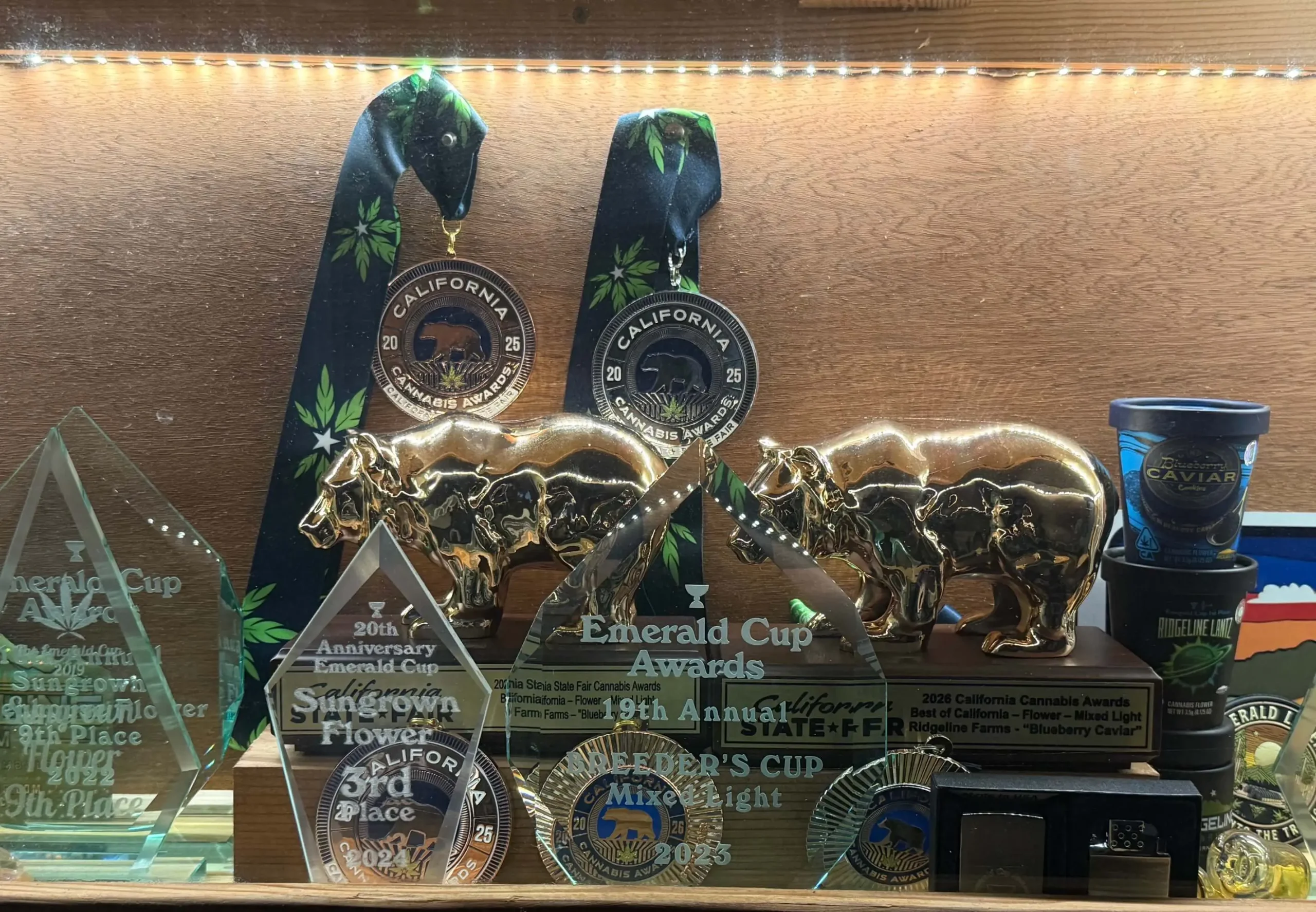 Ridgeline Farms cannabis competition awards featuring golden bear trophies, Emerald Cup honors, and California medals